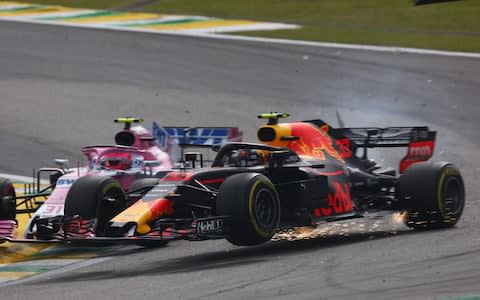 Max Verstappen of the Netherlands driving the (33) Aston Martin Red Bull Racing RB14 TAG Heuer is crashed into by Esteban Ocon of France driving the (31) Sahara Force India F1 Team VJM11 Mercedes on track during the Formula One Grand Prix of Brazil at Autodromo Jose Carlos Pace on November 11, 2018 in Sao Paulo, Brazil. - Credit: Getty Images