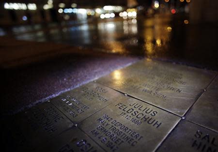 A memorial stone commemorating Holocaust victims is pictured in front of their former home in the second district of Vienna November 9, 2013. The so called tripping stones (Stolpersteine) have been placed at the entrances to houses of Holocaust victims to remind today's population of the Jewish history that used to part of Viennese life. November 9th marks the 75th anniversary of the 'Kristallnacht' ('crystal night' or also referred to as 'night of broken glass') when Nazi thugs conducted a wave of violent anti-Jewish pogroms on the streets of Vienna and other cities in 1938 in Austria and Germany. REUTERS/Leonhard Foeger