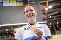 Kirsten Wild from the Netherlands celebrates with her medal after winning the World Championships Scratch women's track cycle race in Berlin, Germany, Wednesday Feb. 26, 2020. (Sebastian Gollnow/dpa via AP)