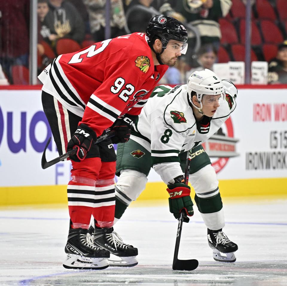 Pavel Novak waits on the wing during a faceoff in the Iowa Wild's preseason game against the Rockford IceHogs.