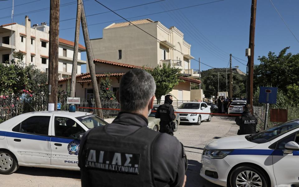 Greek police outside the property in Athens where Ms Crouch was murdered -  John Liakos/Intime News/Athena Pictures