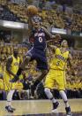 Atlanta Hawks' Jeff Teague shoots against Indiana Pacers' George Hill during the first half in Game 1 of an opening-round NBA basketball playoff series on Saturday, April 19, 2014, in Indianapolis. (AP Photo/Darron Cummings)