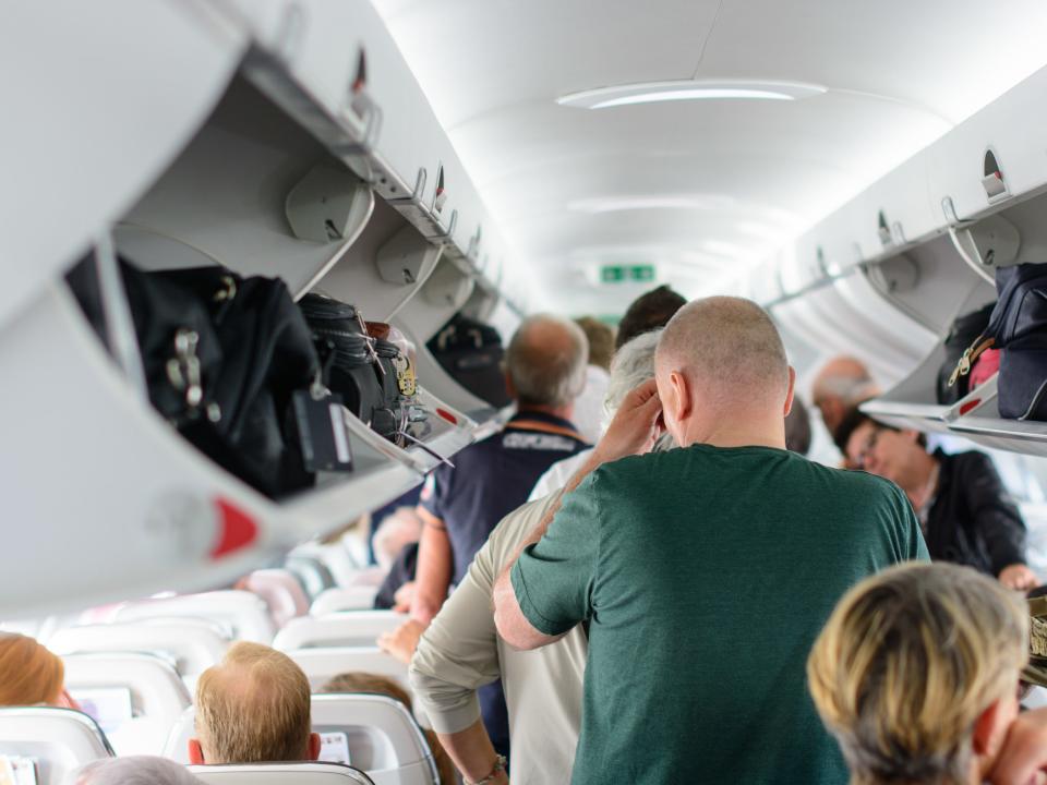 exiting plane disembarking overhead airplane