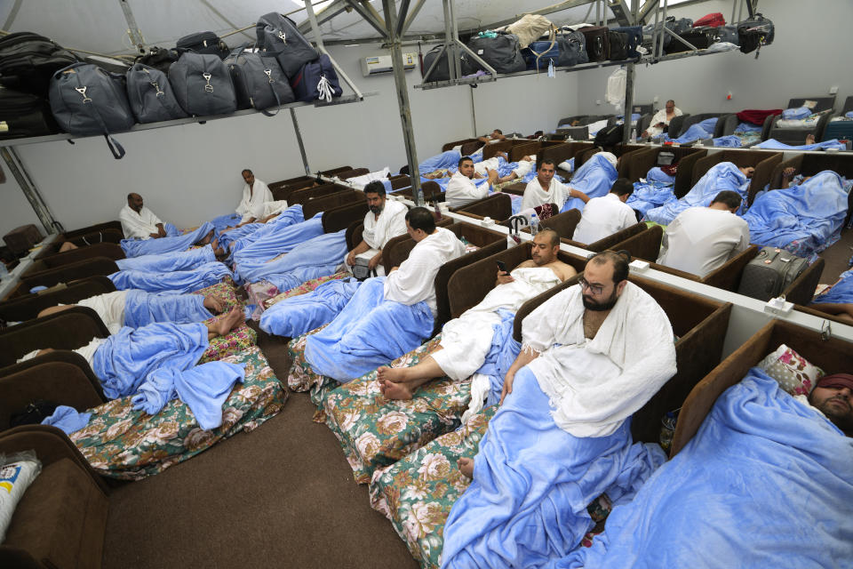 Muslim pilgrims rest at the Mina tent camp during the Hajj, in Mecca, Saudi Arabia, during the annual hajj pilgrimage, Monday, June 26, 2023. Muslim pilgrims are converging on Saudi Arabia's holy city of Mecca for the largest hajj since the coronavirus pandemic severely curtailed access to one of Islam's five pillars. (AP Photo/Amr Nabil)