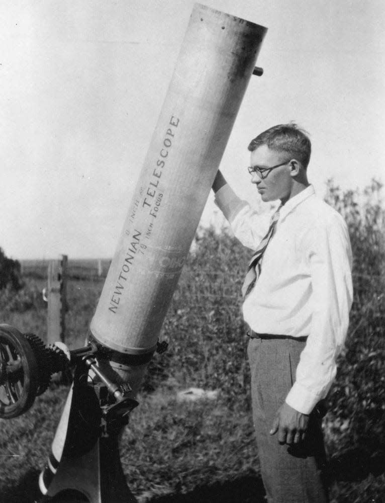 The astronomer Clyde Tombaugh, discoverer of Pluto here shown with his homemade 9-inch telescope.