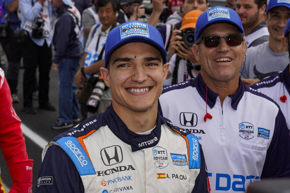 Alex Palou, of Spain, watches as teammate Scott Dixon, of New Zealand, beats his time to take the pole during qualifications for the Indianapolis 500 auto race at Indianapolis Motor Speedway in Indianapolis, Sunday, May 22, 2022. (AP Photo/Michael Conroy)