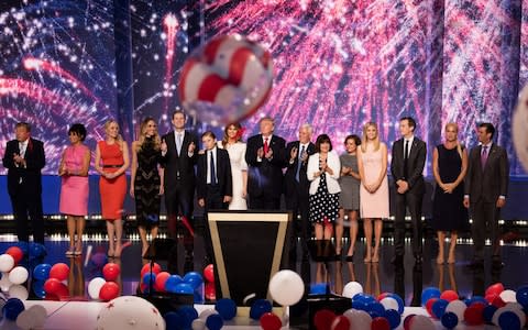 Viktor and Amalija Knavs, left, on stage with Donald Trump during the Republican National Convention at Quicken Loans Arena in July 2016 - Credit: David Hume Kennerly/Getty Image