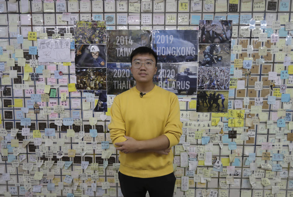 Hong Tsun-ming, a Taiwanese of Hong Kong descent, poses for a photograph in front of the Lennon Wall in Taichung city, Central Taiwan, on Nov. 30, 2023. As Taiwan’s presidential election approaches, many immigrants from Hong Kong are supporting the ruling Democratic Progressive Party after witnessing the alarming erosion of civil liberties at home.(AP Photo/Chiang Ying-ying)