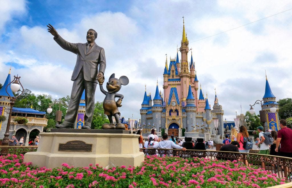 A statue of Walt Disney and Mickey Mouse at Magic Kingdom, Walt Disney World.