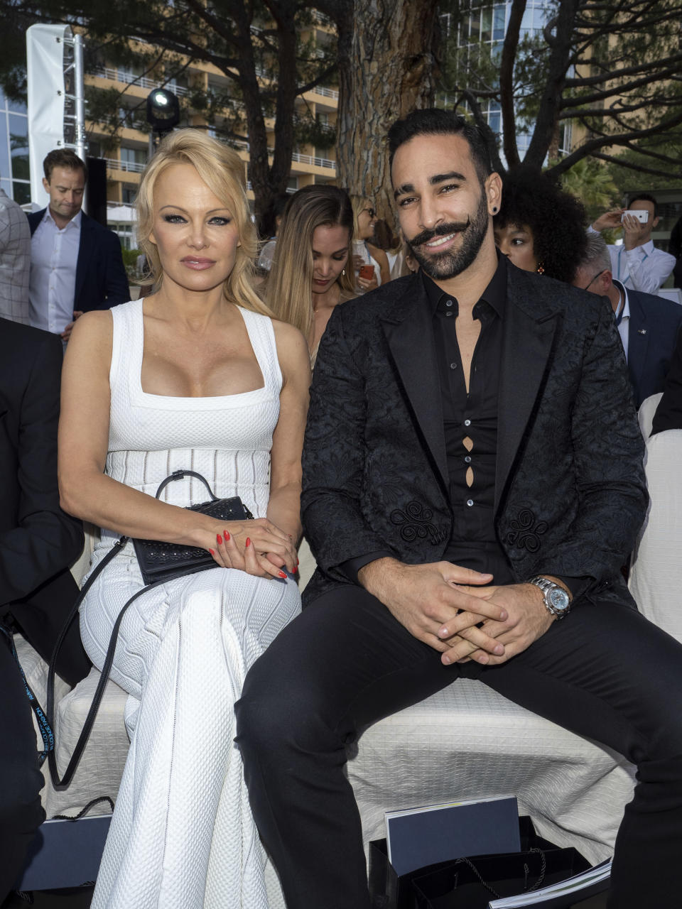 Pamela Anderson and Adil Rami at a fashion show in Monaco on May 24. (Photo: Arnold Jerocki/Getty Images)