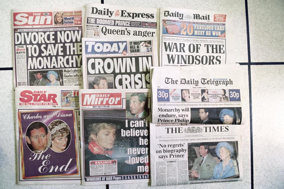 Picture taken on October 17, 1994 at london showing the headlines of the national morning newspapers published the day after the Sunday Times published extracts from an authorised biography on Prince Charles by Jonathan Dimbleby. In the book the prince claims to have been pressured into his marriage to Diana by his father, the Duke of Edinburgh, and that he, in fact, never loved her. - traitement cc (Photo by Johnny EGGITT / AFP) (Photo by JOHNNY EGGITT/AFP via Getty Images)