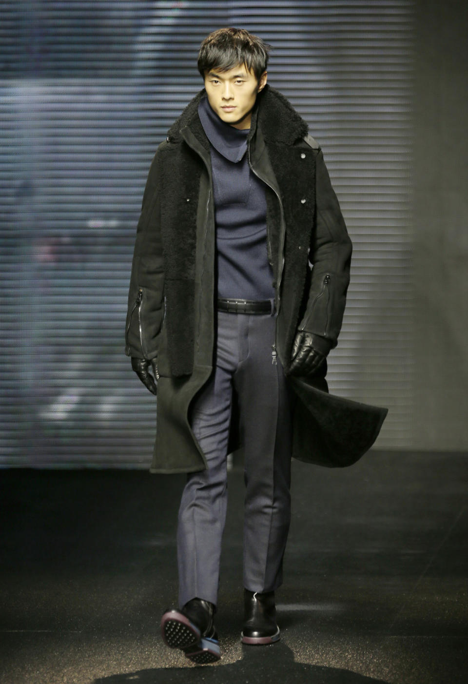 A model wears a creation for Salvatore Ferragamo men's Fall-Winter 2013-14 collection, part of the Milan Fashion Week, unveiled in Milan, Italy, Sunday, Jan. 13, 2013. (AP Photo/Antonio Calanni)