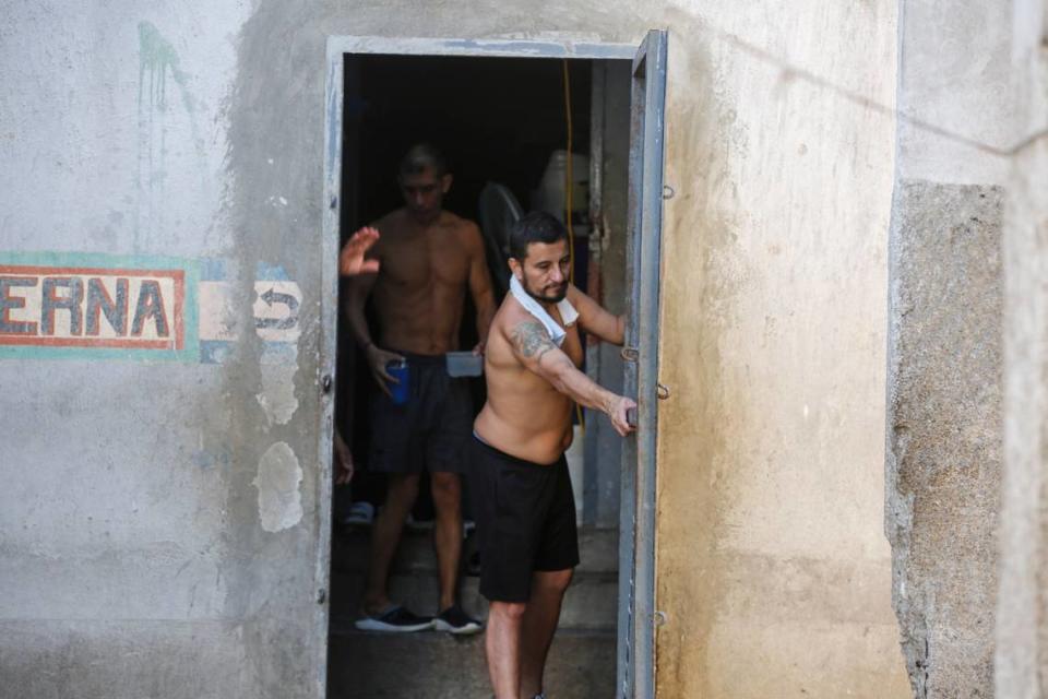 Colombian inmates accused of participating in the assassination of Haitian President Jovenel Moïse open a gate inside the National Penitentiary in Port-au-Prince, Haiti, Sunday, March 3, 2024. Hundreds of inmates fled Haiti’s main prison after armed gangs stormed the facility overnight.