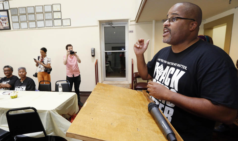 In this Aug. 24, 2018 photo, Cliff Albright, right, co-founder of Black Voters Matter, explains the purpose of a bus tour through the South, at a meeting of several Mississippi grassroots organizations at MACE, Mississippi Action for Community Education, headquarters in Greenville, Miss. The meeting was in part to introduce national media to these hands-on organizations that work throughout the Mississippi Delta and to build interest and excitement for the upcoming election, documenting the campaigning in locales with important upcoming races where black turnout might be key. (AP Photo/Rogelio V. Solis)