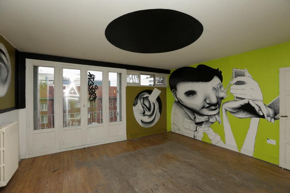 A living room painted by Brazilian street artist Ethos is seen at the street art project tower "Paris Tour 13" in Paris