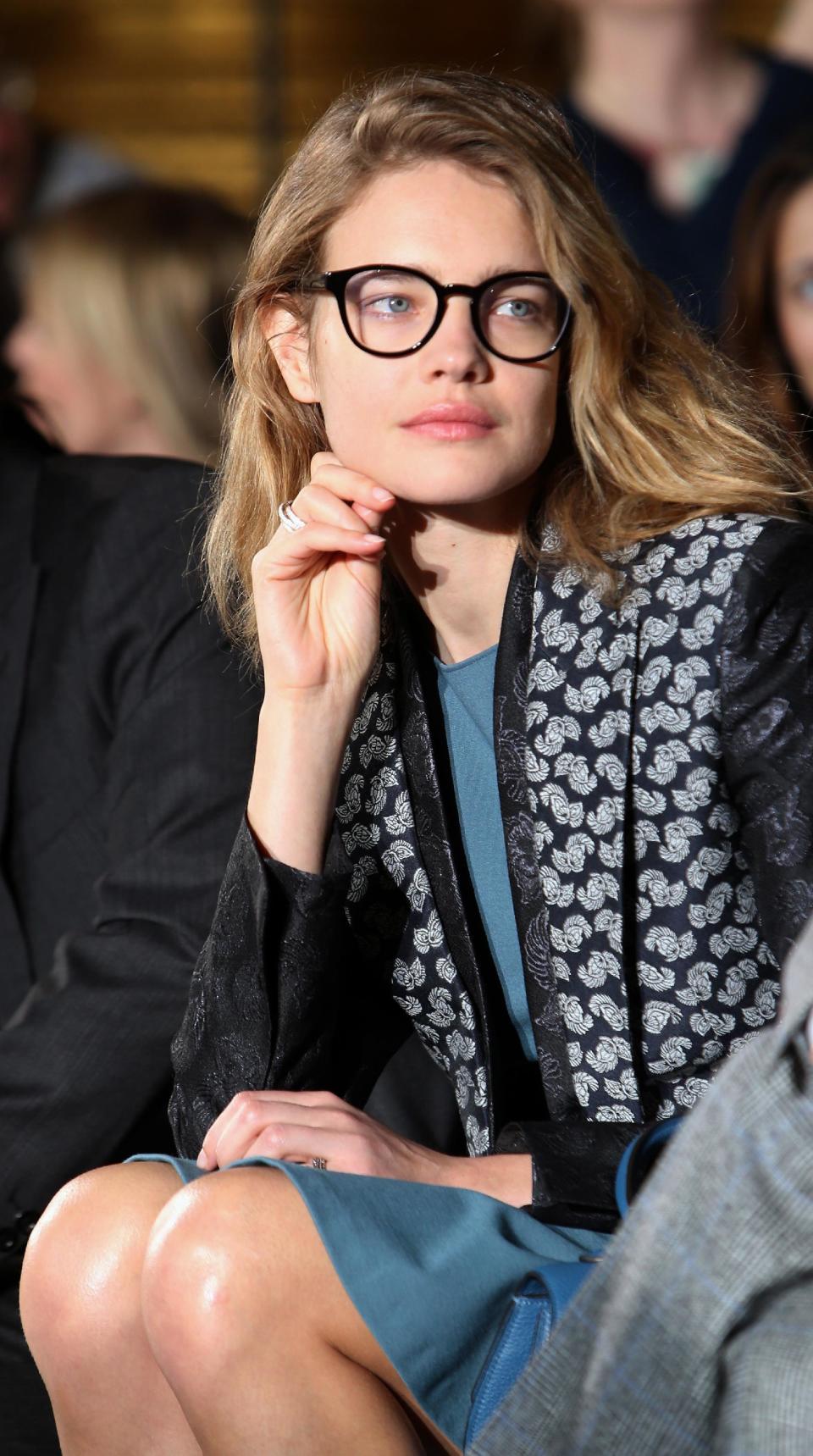 Natalia Vodianova watches fashion designer Stella McCartney's Fall/Winter 2013-2014 ready to wear collection, in Paris, Monday, March, 4, 2013. (AP Photo/Thibault Camus)