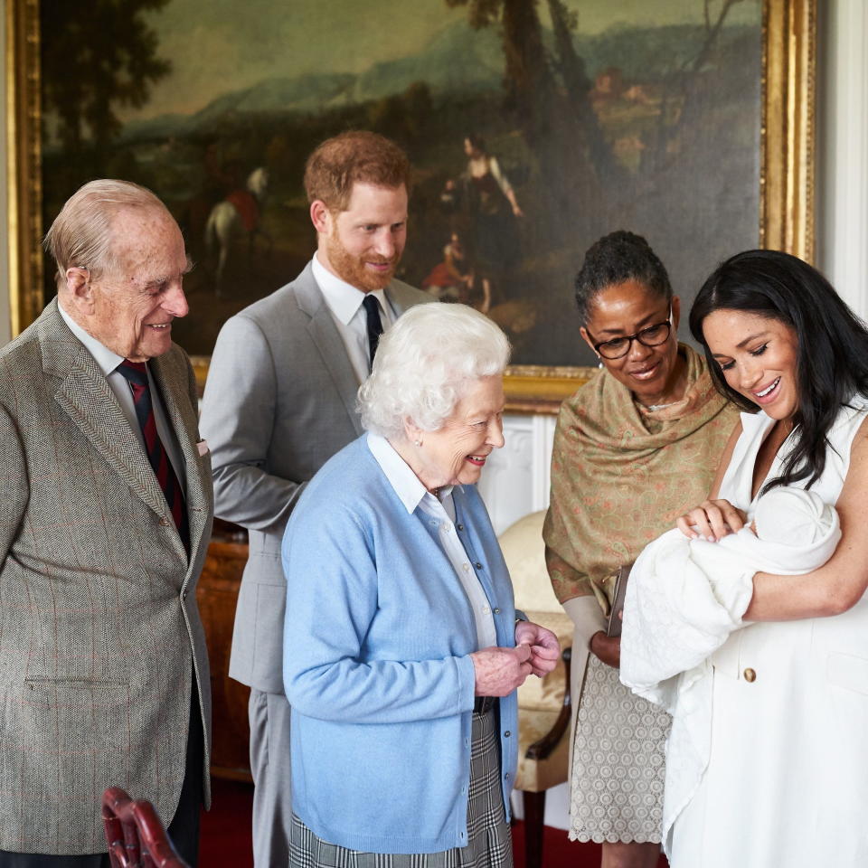 Buckingham Palace shows Britain's Prince Harry, the Duke of Sussex (2-L) and Meghan, the Duchess of Sussex (R) joined by her mother, Doria Ragland (2-R), as they show their newborn son, named as Archie Harrison Mountbatten-Windsor, to Queen Elizabeth II (C) and Prince Philip, Duke of Edinburgh (L) at Windsor Castle, in Windsor, Britain, 