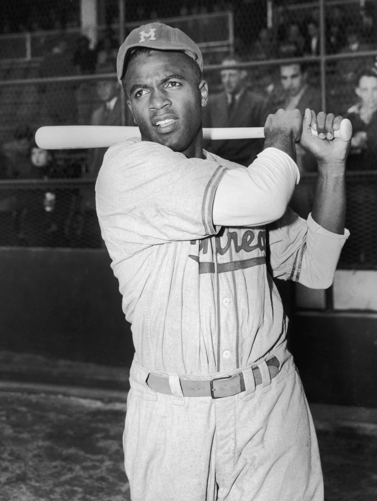 Montreal Royals baseball player Jackie Robinson holds his bat circa 1946. (Keystone / Getty Images)