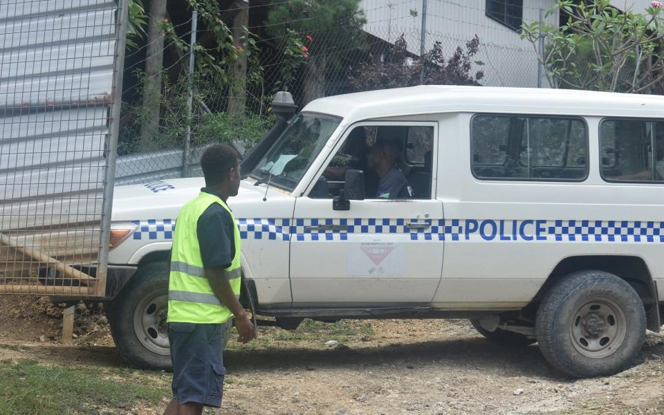 A police vehicle arrives at the scene of a blast which killed two men - via REUTERS