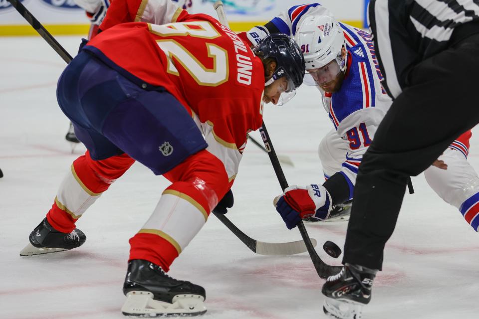 May 28, 2024; Sunrise, Florida, USA; New York Rangers center Alex Wennberg (91) and Florida Panthers center Kevin Stenlund (82) face-off during the first period in game four of the Eastern Conference Final of the 2024 Stanley Cup Playoffs at Amerant Bank Arena.