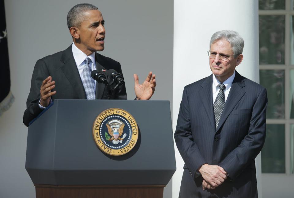 U.S. President Barack Obama, left, stands with Judge Merrick B. Garland at the White House while nominating him to the U.S. Supreme Court on March 16, 2016. <a href="https://www.gettyimages.com/detail/news-photo/president-barack-obama-stands-with-judge-merrick-b-garland-news-photo/515910174?adppopup=true" rel="nofollow noopener" target="_blank" data-ylk="slk:Chip Somodevilla/Getty Images;elm:context_link;itc:0;sec:content-canvas" class="link ">Chip Somodevilla/Getty Images</a>