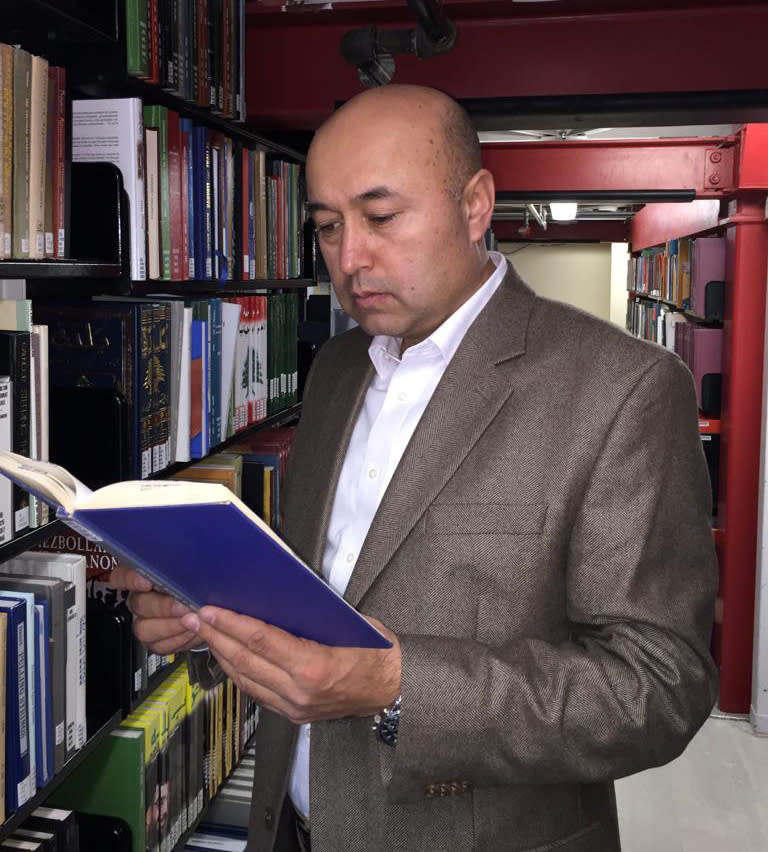This 2015 photo provided by his family shows Yalqun Rozi at Stanford University in Stanford, Calif. Rozi is one of over four hundred prominent Uighur academics, writers, performers and artists who have been detained, according to advocacy groups, joining an estimated one million people or more held in internment camps and prisons in China’s far western region of Xinjiang. (AP Photo/Yalqun Family)