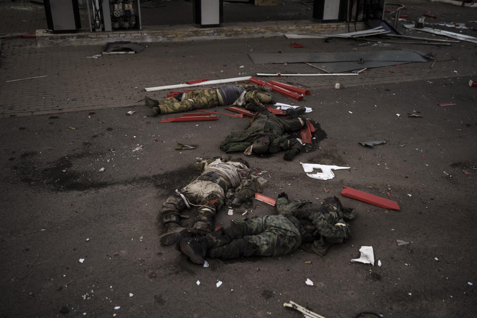 The bodies of unidentified men, believed to be Russian soldiers, arranged in a Z, a symbol of the Russian invasion, lie near a village recently retaken by Ukrainian forces on the outskirts of Kharkiv, Ukraine, Monday, May 2, 2022. The outskirts of Kharkiv have the feel of an open-air morgue, where the dead lie unclaimed and unexplained, sometimes for weeks on end, as Ukrainian and Russian forces fight for control of slivers of land. (AP Photo/Felipe Dana)