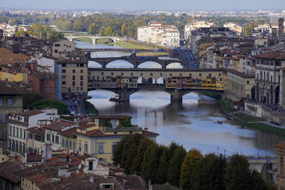 A view of Florence's Ponte Vecchio, Italy, Wednesday, Nov. 9, 2022. Restorers in Florence have begun a six-month project on "Allegory of Inclination", a 1616 work by Artemisia Gentileschi, using modern techniques including x-rays and UV infrared research to go beneath the veils painted over the original painting to cover nudities and discover the work as Gentileschi painted it. (AP Photo/Andrew Medichini)