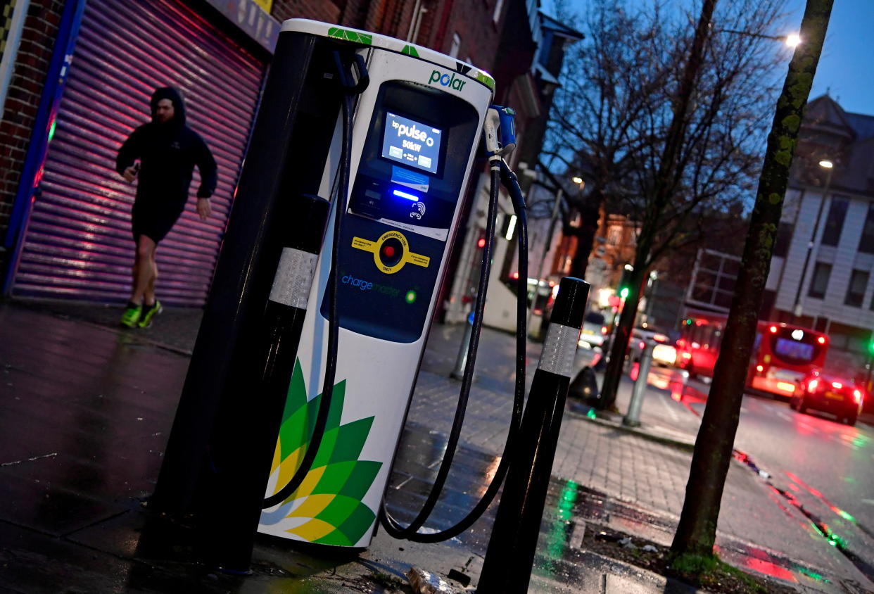 A man runs past a BP (British Petroleum) EV (Electric Vehicle) charge point in London, Britain, January 30, 2021. (Toby Melville/Reuters)