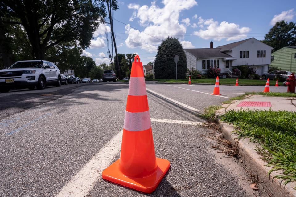 Aug 18, 2023; Clifton, New Jersey, USA; A car drives a traffic cone on Pershing Road. Mandatory Credit: Anne-Marie Caruso-The Bergen Record