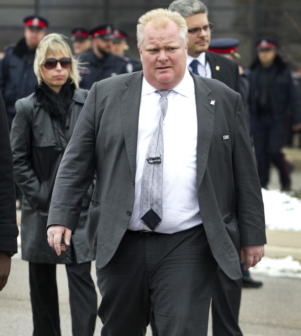 Toronto mayor Rob Ford and his wife Renata leave the public memorial for police constable John Zivcic in Toronto