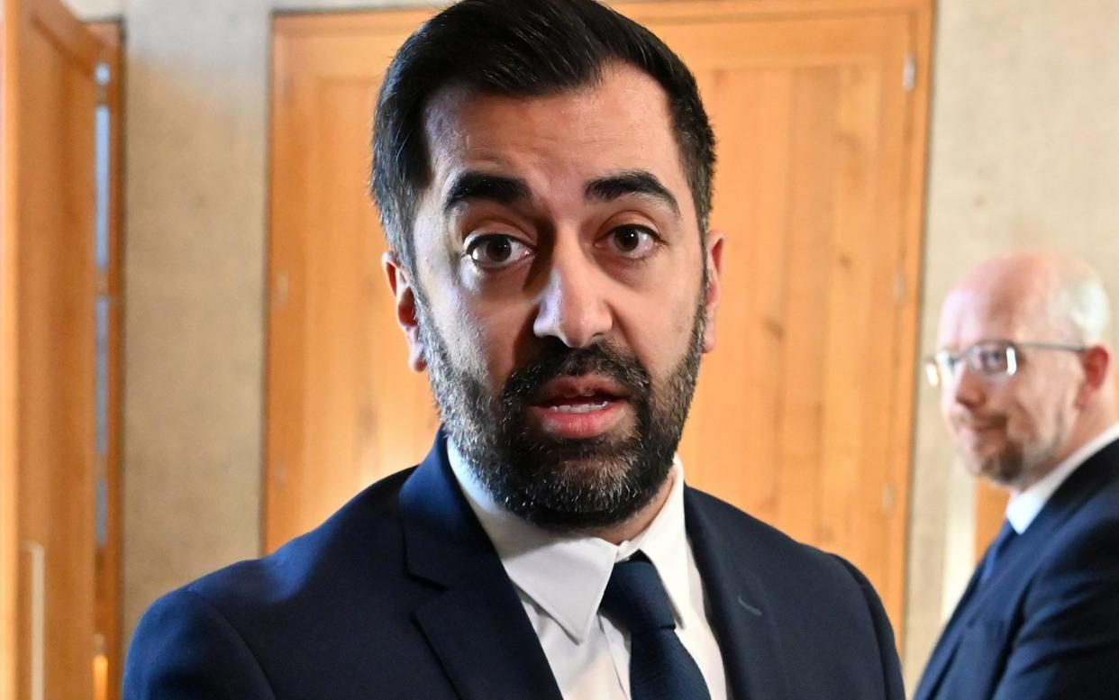 Humza Yousaf looks at the camera