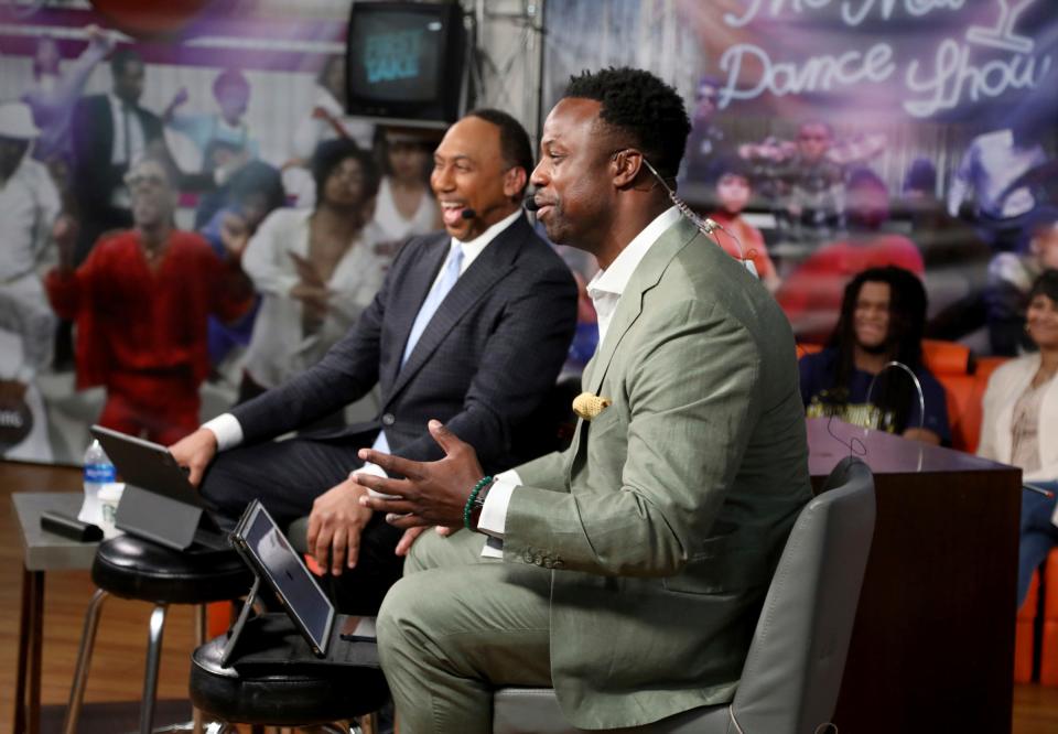 Stephen A. Smith, left, and Bart Scott, a former Detroit Southeastern and NFL player, during the airing of "First Take" from WGPR in Detroit on Friday, Sept. 9, 2022. The live show had a studio audience made up of Detroit sports fans listening to the two talk about football and other sports related topics.
