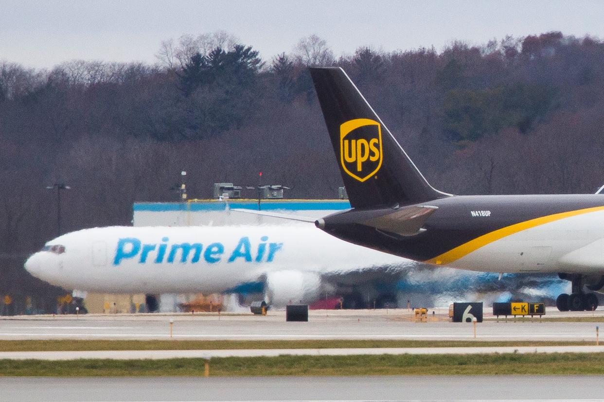 UPS and Prime Air cargo planes travel on the tarmac on Wednesday, Nov. 27, 2019, at Chicago Rockford International Airport in Rockford.
