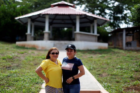 Sisters Isilda and Emily Hernandez pose for a photograph at Emily's house in Intipuca, El Salvador, August 14, 2018. REUTERS/Jose Cabezas