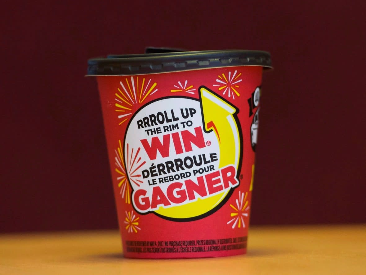 Tim Hortons says 'technical errors' were behind a mistake that told some people they won a boat as part of the chain's Roll Up The Rim promo. (Nathan Denette/The Canadian Press - image credit)