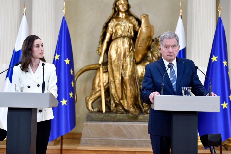 Finland’s President Sauli Niinisto and outgoing Prime Minister Sanna Marin (AP)