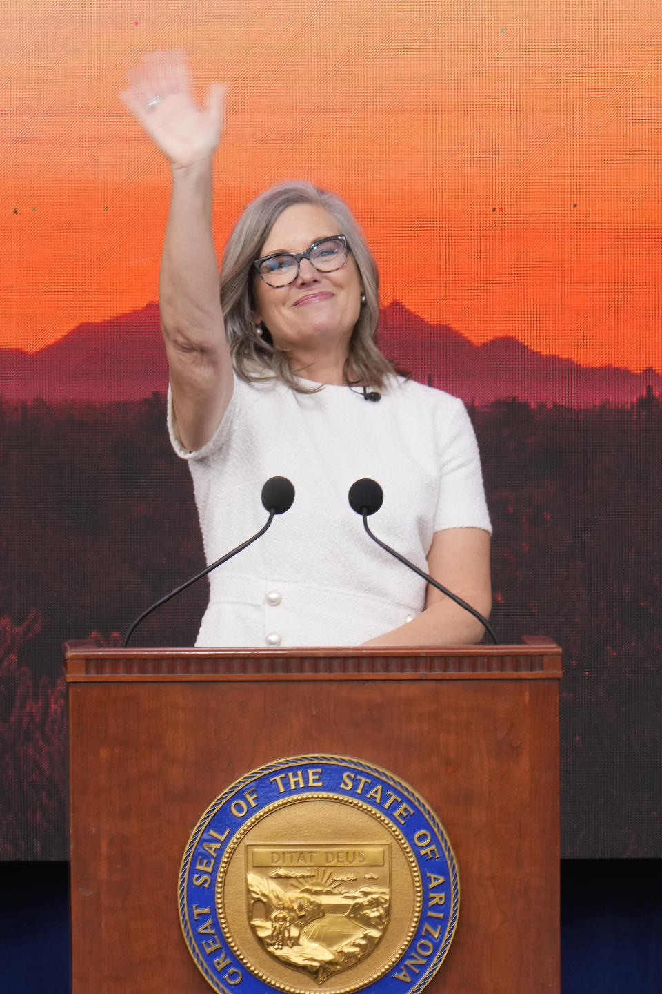 Arizona Democratic Gov. Katie Hobbs waves to a cheering crowd after taking a ceremonial oath of office during a public inauguration at the state Capitol in Phoenix, Thursday, Jan. 5, 2023. (AP Photo/Ross D. Franklin)