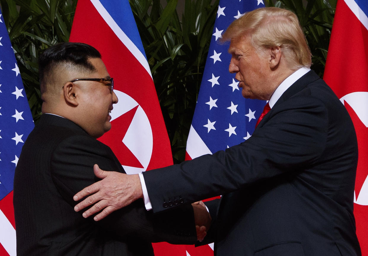Donald Trump meeting North Korean leader Kim Jong Un in Singapore on 12 June 2018. (AP Photo/Evan Vucci)