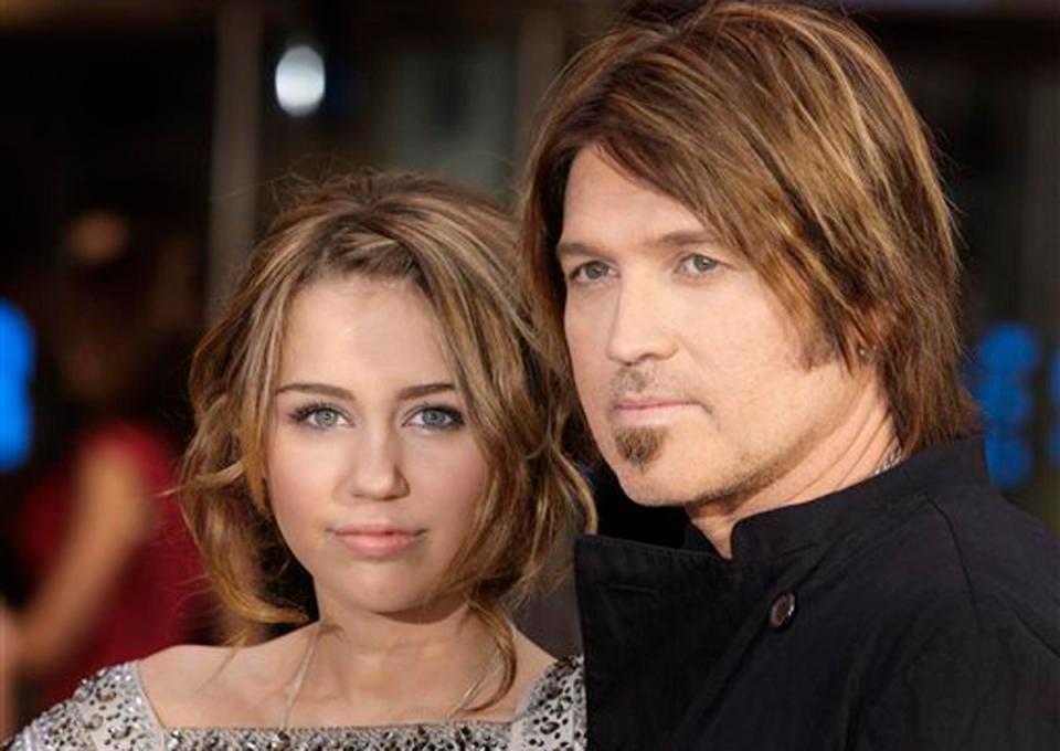 Miley Cyrus with her father, country musician Billy Ray Cyrus (Associated Press)