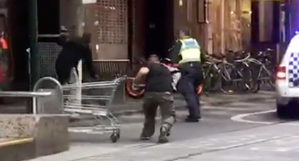 “Trolley man” rushes at the man wielding a knife. Source: Twitter