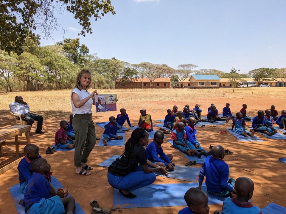 Exeter resident and Club Pilates instructor Lindsey Burns recently traveled to Kenya.  Here she is teaching yoga to students at the Wakela Secondary School.