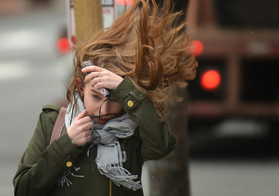 <p>Pedestrians face powerful storm which generates significant high winds in Washington, March 2, 2018, causing wide-spread flooding and trees to topple around the region. (Photo: Astrid Riecken for The Washington Post via Getty Images) </p>