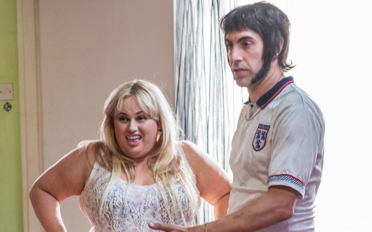 Sacha Baron Cohen and Rebel Wilson in the film Grimsby