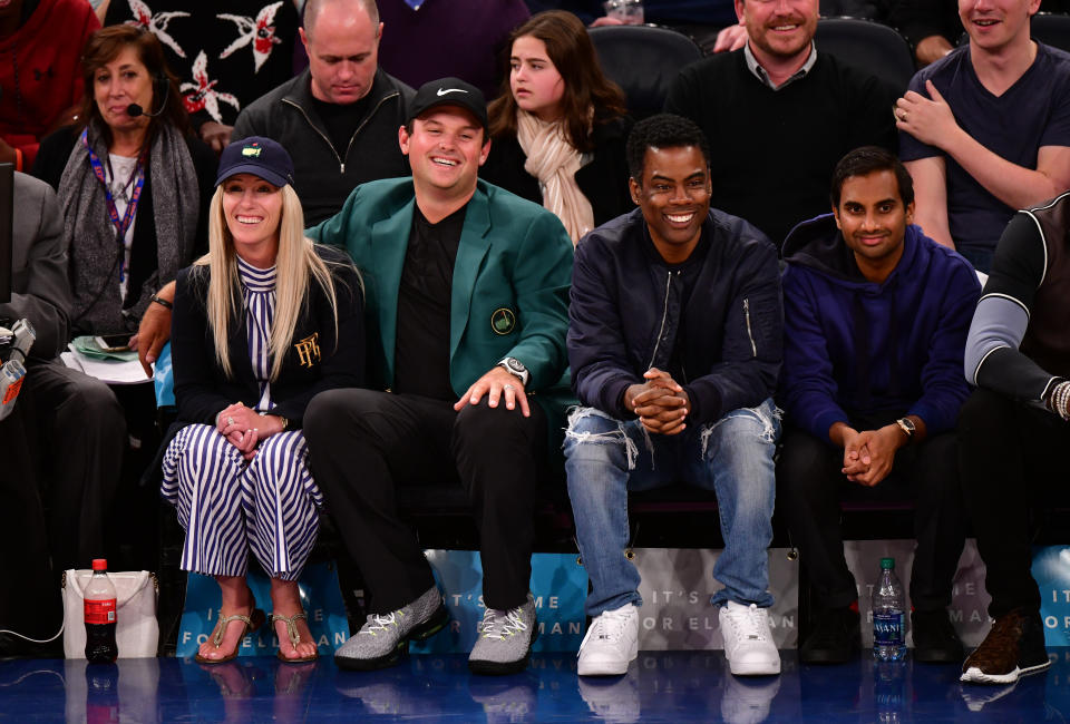 Chris Rock and Aziz Ansari were also seated near Masters winner Patrick Reed and his wife, Justine Reed, at the Knicks game on April 9. (Photo: James Devaney/Getty Images)