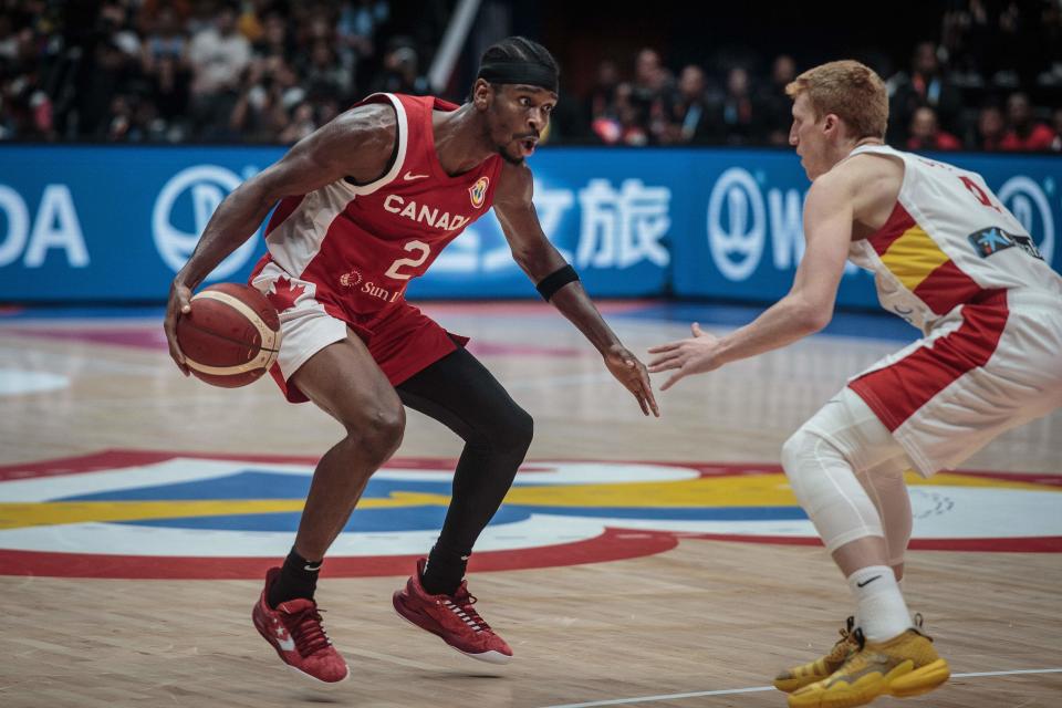 Canada’s Shai Gilgeous-Alexander (L) dribbles against Spain’s Alberto Diaz during the FIBA Basketball World Cup group L match between Spain and Canda at Indonesia Arena in Jakarta on September 3, 2023. (Photo by AFP) (Photo by -/AFP via Getty Images)