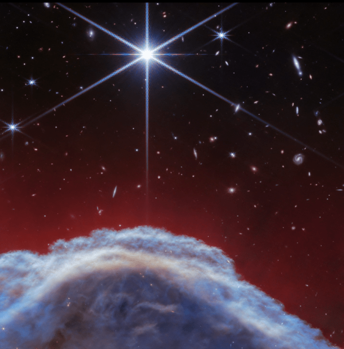 The Horsehead Nebula, imaged by the NIRCam instrument on NASA’s Webb Telescope, features a portion of the horse’s “mane” about 0.8 light-years wide. The blue clouds at the bottom of the image are dominated by cold, molecular hydrogen. Red wisps above the nebula represent mainly atomic hydrogen gas. Credit: NASA, ESA, CSA, K. Misselt (University of Arizona) and A. Abergel (IAS/University Paris-Saclay, CNRS)