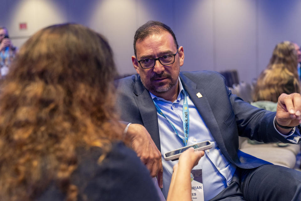 Arizona Secretary of State Adrian Fontes, right, attends the summer meeting of the National Association of Secretaries of State, Tuesday, July 11, 2023, in Washington. Efforts to deceive the public about voting and elections remain a top concern for state election officials as they dig into preparations for the 2024 election. (AP Photo/Jacquelyn Martin)