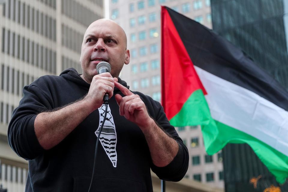 Amer Zahr speaks as people march to call for cease fire in Gaza in downtown Detroit on Saturday, Oct. 28, 2023.