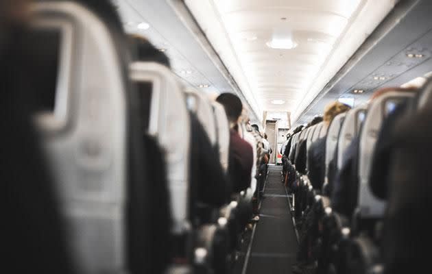 Crew will put a blanket on the person and try and move passengers away. Photo: Getty